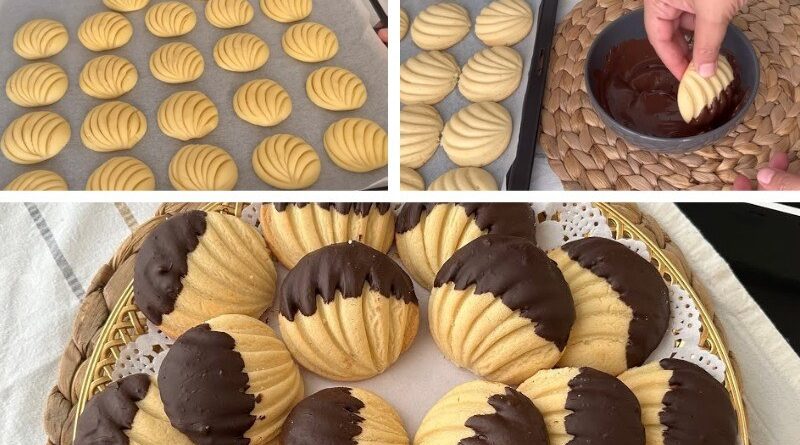 ŠKOLJKICE KEKSIĆI UMOČENI U ČOKOLADU…Neodoljivi keksići u obliku školjke – prhki, mirisni i djelimično umočeni u čokoladu za savršenu ravnotežu okusa! - featured image ŠKOLJKICE KEKSIĆI UMOČENI U ČOKOLADU…Neodoljivi keksići u obliku školjke – prhki, mirisni i djelimično umočeni u čokoladu za savršenu ravnotežu okusa! - featured image